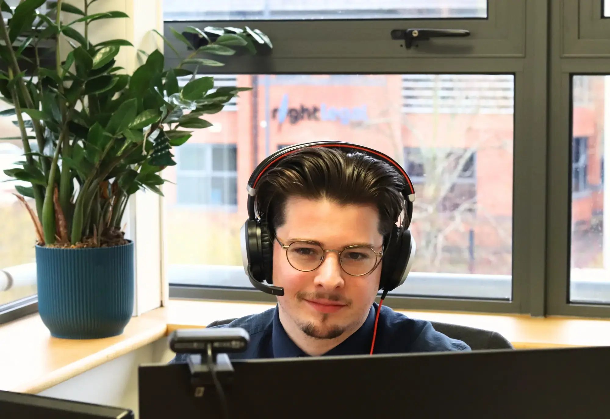 John-James sat at his desk writing copy for a client for their website, landing pages and blog articles